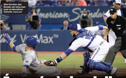  ?? PHOTOUAFP ?? Alex Gordon, des Royals, est venu marquer en deuxième manche.