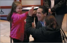  ?? AP PHOTO/ RICHARD DREW ?? New York Gov. Andrew Cuomo meets a future voter before voting at the Presbyteri­an Church of Mount Kisco, in Mt. Kisco, N.Y. Tuesday, Nov. 6, 2018.