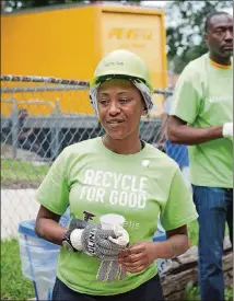  ??  ?? Rashawn Medley takes a break from building her new Habitat for Humanity home. The four-bedroom woodframe house was constructe­d using proceeds from the sale of aluminum cans collected at Falcons and Atlanta United games.