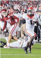  ?? CURTIS COMPTON/ASSOCIATED PRESS ?? Georgia running back Sony Michel (1) runs for the game-winning touchdown in overtime during Monday’s Rose Bowl.