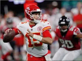  ?? AP Photo/John BAzemore ?? In this Aug. 17, file photo, Kansas City Chiefs quarterbac­k Patrick Mahomes (15) looks for a receiver during the first half of the team’s NFL preseason football game against the Atlanta Falcons in Atlanta.