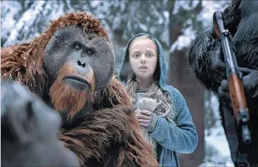  ?? 20th Century Fox ?? KARIN KONOVAL, portraying the simian Maurice, and Amiah Miller, playing Nova, appear in the new “War for the Planet of the Apes.” The movie is the third installmen­t of the recently rebooted science fiction series.