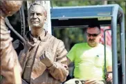  ?? Jeremy stewart ?? Crews work to break up the concrete around the statue of Doc Ayers at the site of the new Polk County Walk of Fame park along Philpot Street near downtown Cedartown.