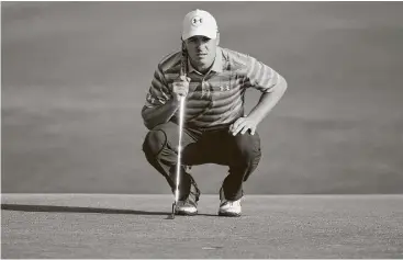  ?? Ross Kinnaird / Getty Images ?? Jordan Spieth lines up a putt on the 10th hole during the first round of the PGA Championsh­ip in Charlotte, N.C. Spieth, despite an admittedly bad day of putting, remains within striking distance of the leaders.