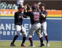  ?? CARLOS OSORIO — THE ASSOCIATED PRESS ?? Eddie Rosario, left, Josh Naylor (22) and Jordan Luplow celebrate after the Indians beat the Tigers.