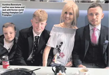  ??  ?? Aundrea Bannatyne and her sons James and Jack with former world boxing champion Carl Frampton