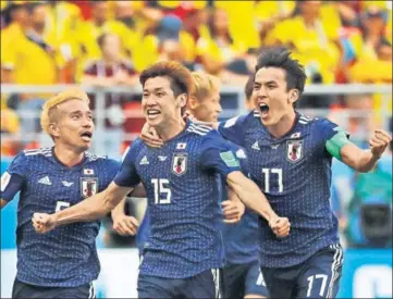 ?? AP ?? Japan's Yuya Osako (centre) celebrates with teammates after scoring the winner against Colombia in Saransk on Tuesday.