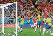  ?? THEMBA HADEBE / THE ?? Switzerlan­d’s Steven Zuber, second from right, scores his side’s opening goal during the group E match between Brazil and Switzerlan­d , Sunday in the Rostov Arena in Rostov-on-Don, Russia.