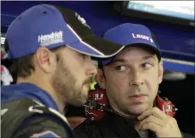  ?? MARY SCHWALM - THE ASSOCIATED PRESS ?? FILE - In this July 15, 2011, file photo, driver Jimmie Johnson, left, talks with crew chief Chad Knaus during practice for the NASCAR Lenox Industrial Tools 300 auto race at New Hampshire Motor Speedway in Loudon, N.H.