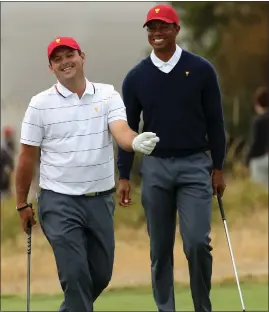  ??  ?? Patrick Reed with US captain Tiger Woods at the Presidents Cup