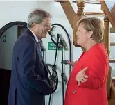  ??  ?? Con Merkel Gentiloni con la cancellier­a tedesca