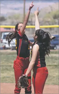  ?? ?? Two Lady Sundevils celebrate an out against Taos on Saturday (April 9).