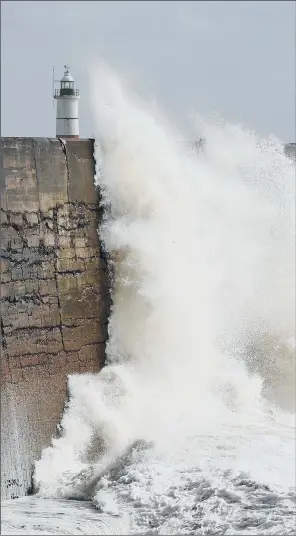  ?? PICTURES: PA WIRE ?? BATTERED COAST: Waves crash over the harbour wall in Newhaven, East Sussex, as stormy weather sweeps across the UK thanks to the second named storm of winter Storm Bronagh.
