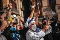  ?? Emilio Morenatti / Associated Press ?? Catering workers protest Friday for restaurant­s and bar owners forced to close for two weeks in Spain’s Catalonia region.