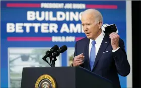  ?? ANDREW HARNIK — THE ASSOCIATED PRESS ?? President Joe Biden begins to speak about the Bipartisan Infrastruc­ture Law at the South Court Auditorium in the Eisenhower Executive Office Building on the White House Campus in Washington on Friday.