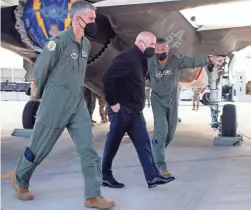  ??  ?? Kelly, center, tours the F-35 flight line at Luke Air Force Base in Glendale on Tuesday during his first tour of the facility as a senator.