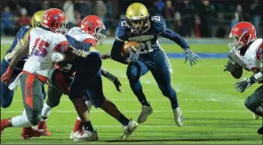  ?? Special to the Democrat-Gazette/JIMMY JONES ?? Pulaski Academy running back Jayden Kelley (21) runs through a hole in the Little Rock McClellan defense Friday during the Bruins’ 58-8 victory over the Lions.