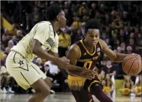  ?? RICK SCUTERI — THE ASSOCIATED PRESS ?? Arizona State guard Tra Holder (0) drives on Vanderbilt guard Saben Lee (0) in the second half during an NCAA college basketball game, Sunday in Tempe, Ariz. Arizona State defeated Vanderbilt 76-64.