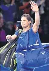  ??  ?? Rafael Nadal waves to the crowd after losing his singles match against Belgium's David Goffin on day two of the ATP World Tour Finals tennis tournament in London.