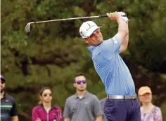  ?? Associated Press ?? ■ Zach Johnson tees off on the seventh hole during the third round at the Valero Texas Open golf tournament Saturday in San Antonio.