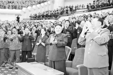  ??  ?? Kim claps during a celebratio­n for nuclear scientists and engineers who contribute­d to a hydrogen bomb test, in this undated photo released by North Korea’s Korean Central News Agency (KCNA) in Pyongyang. — Reuters photo