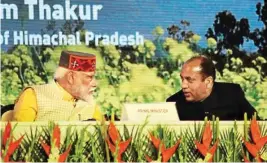  ?? BABLI THAKUR/MPOST ?? Prime Minister Narendra Modi with Himachal Pradesh Chief Minister Jai Ram Thakur at the Rising Himachal "Global Investors' Meet" in Dharamshal­a on Thursday