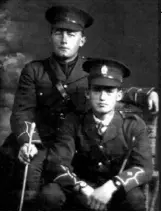  ??  ?? In uniform: Averill with his friend Paul Clark, left, in 1917 before departing for the war; below, Averill at Le Quesnoy in 1923, at the unveiling of the New Zealand memorial, pointing to where he made his ascent.