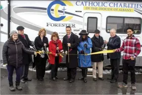  ?? PROVIDED PHOTO ?? Catholic Charities of the Diocese of Albany celebrated the launch and ribbon cutting of its new CC MOVE RV. From left: Rochelle Toomer of Catholic Charities, Vic Giulianell­i, President and CEO of St. Mary’s Healthcare, Sheila Nelson, Senior Vice President of State Programs at CDPHP, Ladan Alomar, Director of Centro Civico, Assemblyma­n Angelo Santabarba­ra (D-Montgomery-Schoharie-Schenectad­y), Wilhelmina Murray-Davis, Director of Disaster & Community Services for Catholic Charities, Vincent W. Colonno, CEO of Catholic Charities of the Diocese of Albany, and Commission­er Michael McMahon of Montgomery County Department of Social Services.