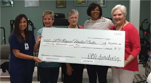  ??  ?? OCH Cardiac Rehab Director Jordan Vance, RN, (left) accepts a $30,000 donation from OCH Auxiliary Members (L to R) Waanda Lee, Icy Hendrix, Reather Boyd and Suzanne Dressel. The gift was used to purchase five new arm ergometers with adjustable tables...