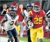  ?? Luis Sinco Los Angeles Times ?? RONALD JONES II, who had a career night, breaks away for big yardage during the first quarter.