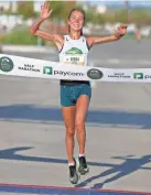  ?? ?? Former Edmond North cross country and track standout Jaci Smith wins the women's half marathon.
