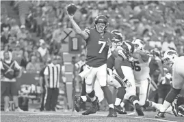  ?? RICH BARNES/AP ?? Vikings quarterbac­k Case Keenum, left, throws a pass during the first half of a preseason game against the Bills Thursday in Orchard Park, N.Y.