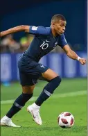  ?? SHAUN BOTTERILL / GETTY IMAGES ?? Kylian Mbappe, 19, the emerging star of France, has Algerian and Cameroonia­n roots. France’s 1998 championsh­ip team was known for its mix of black, white and Arabic players and became a potent antiracist symbol.