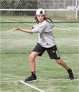  ?? ?? Harvey Osborne is a picture of concentrat­ion as he gets ready to rip a forehand for Warragul Purple.