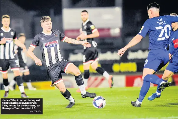  ?? JON CORKEN ?? James Tilley in action during last night’s match at Blundell Park. Tilley netted for the Mariners, but Harrogate Town prevailed 2-1.