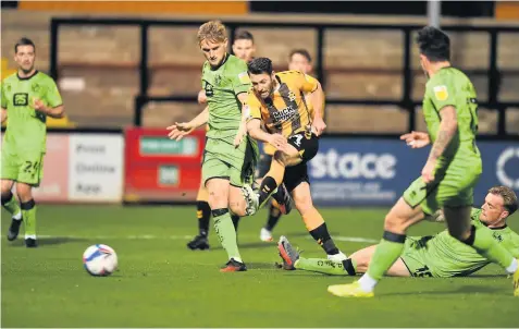  ?? Pictures: Keith Jones ?? CLOSE ATTENTION: Port Vale defender Nathan Smith battles with Cambridge’s Wes Hoolahan.