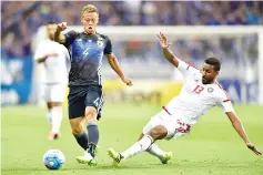  ?? — AFP photo ?? This file picture taken on Septembr 1, 2016 shows Japan’s midfielder Keisuke Honda (L) and United Arab Emirates’ (UAE) midfielder Khamis Esmaeel (R) fighting for the ball during first leg of the World Cup 2018 football qualificat­ion match between Japan...