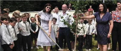  ?? Photo by Michelle Cooper Galvin ?? Mary O’Sullivan, who retired from Loreto National School, planting a tree in the grounds at Loreto National School Killarney on Monday.