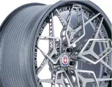  ??  ?? HRE’s 3-D-printed wheel concept combines six separate pieces fastened together with titanium “bolts” and finished with a carbon-fibre rim.