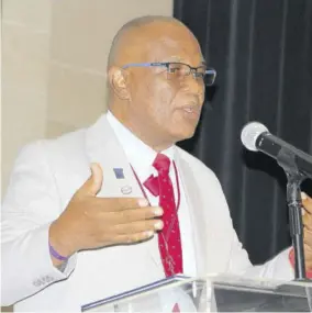  ?? ?? President of the Realtors Associatio­n of Jamaica Newton Johnson addresses the Internatio­nal Real Estate Conference and Expo at the Montego Bay Convention Centre in St James, Thursday.
