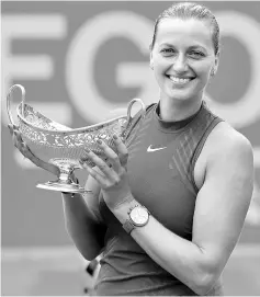  ?? — Reuters photo ?? Kvitova celebrates with the trophy after winning the final against Australia’s Ashleigh Barty at the WTA Premier Aegon Classicin Edgbaston Priory Club in Birmingham, Britain.