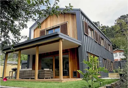  ?? STACY SQUIRES/STUFF ?? The simple form of this new Christchur­ch Passive House helps keep it comfortabl­e and energy efficient.