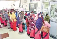  ??  ?? Anganwadi workers stand in a queue as they wait for their turn to get vaccinated in Beawar on Monday.