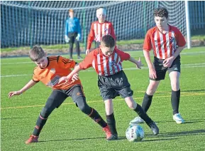  ??  ?? DUSC (tangerines) beat St Andrews Colts 6-2 in the U/13 Cafe Royale League at Craigie 3G.