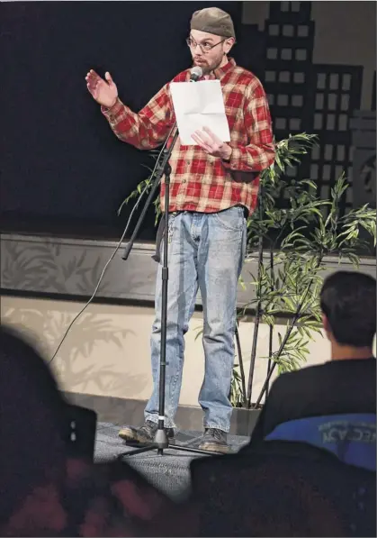  ?? Photos by Lori Van Buren / Times Union ?? Participan­ts introduced as Sam, above, and Luis “L-majesty” Pabon, right, read poems during Capcity Slam at the Albany Barn on Wednesday night in Albany. The competitiv­e part of the evening is graded by judges from the audience.