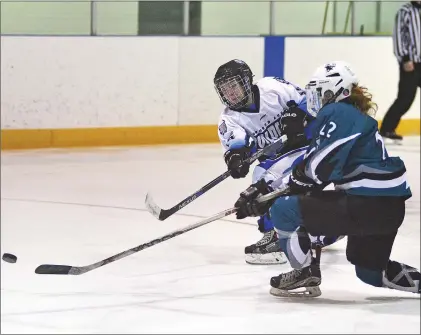  ?? STEVEN MAH/SOUTHWEST BOOSTER ?? Wildcats’ forward Janessa Fournier (left) one-timed a shot on goal during Sunday’s 3-2 overtime loss to the Battleford­s Sharks.