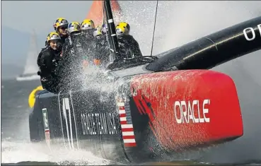  ?? Picture: REUTERS ?? RACING INTO HISTORY: Crew huddle on board Oracle Team USA as the America’s Cup catamaran entry races to a historic seven-win run against Emirates Team New Zealand. British Olympic legend Ben Ainslie took a large slice of the credit for Oracle’s...