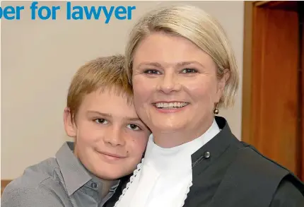  ??  ?? Fiona Guy Kidd with her son, Robert, 12, after the ceremony at the Invercargi­ll District Court where Guy Kidd became the first person to be sworn into the Queens Council from Invercargi­ll. JOHN HAWKINS/STUFF