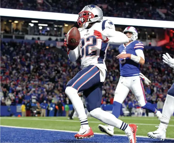  ?? NAncy lAnE / HErAld stAFF FIlE ?? TAKING IT BACK: Devin McCourty returns an intercepti­on for a touchdown against the Bills on Oct. 29, 2018.