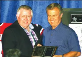  ?? Penticton Herald file photo ?? Darcy Rota presents Vernon Vipers owner Duncan Wray, left, with a plaque during the 2011 B.C. Hockey Hall of Fame induction ceremony in Penticton.